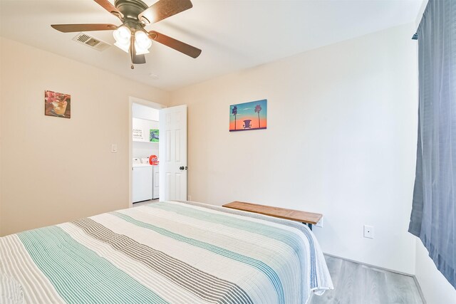 1004 20th St, Dickinson, TX 77539 - bedroom with washer and clothes dryer, wood finished floors, and ceiling fan