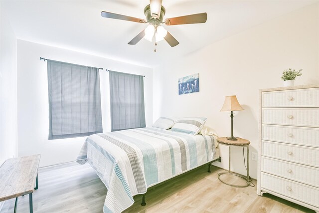 1004 20th St, Dickinson, TX 77539 - bedroom with wood finished floors and ceiling fan
