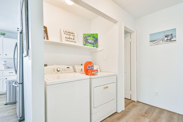 1004 20th St, Dickinson, TX 77539 - laundry room with independent washer and dryer and light wood-type flooring