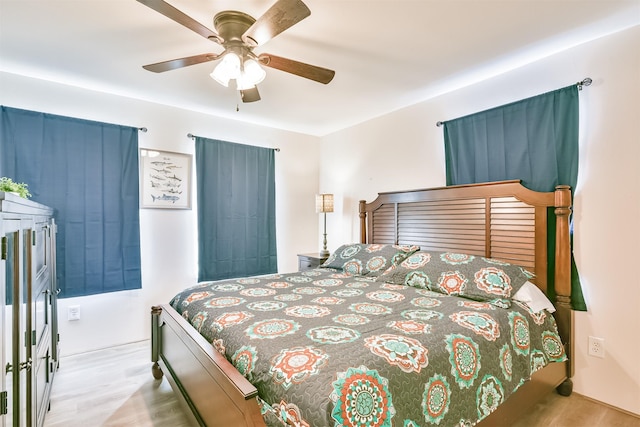 1004 20th St, Dickinson, TX 77539 - bedroom with wood finished floors and a ceiling fan