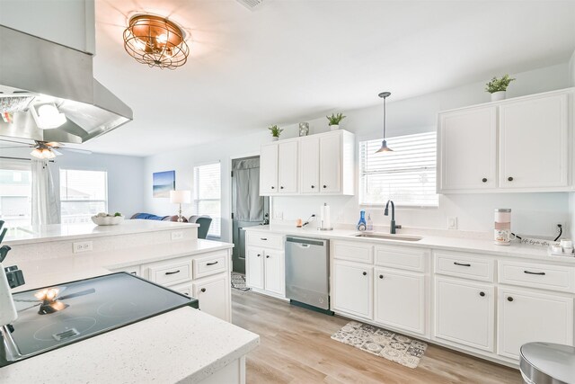 1004 20th St, Dickinson, TX 77539 - kitchen featuring stainless steel dishwasher, a sink, and plenty of natural light