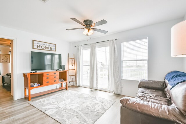 1004 20th St, Dickinson, TX 77539 - living room with ceiling fan and wood finished floors