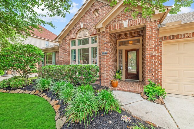 26122 Savory Springs Ln, Katy, TX 77494 - property entrance with brick siding and a garage