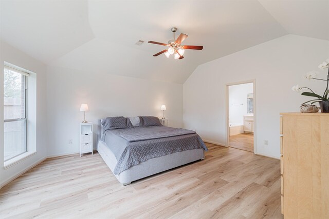 26122 Savory Springs Ln, Katy, TX 77494 - bedroom with lofted ceiling, light wood-type flooring, ensuite bathroom, a ceiling fan, and baseboards