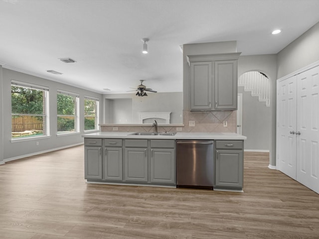 20211 Sunrise Glen Ct, Spring, TX 77379 - kitchen with gray cabinets, dishwasher, a sink, arched walkways, and a ceiling fan