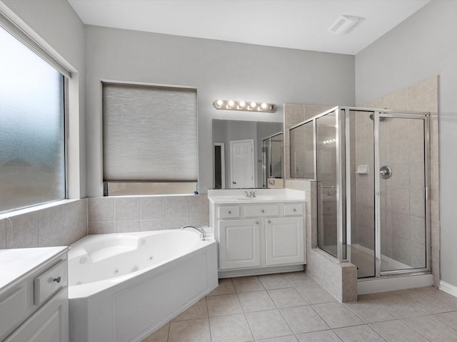 20211 Sunrise Glen Ct, Spring, TX 77379 - bathroom featuring plenty of natural light, a stall shower, vanity, and tile patterned floors