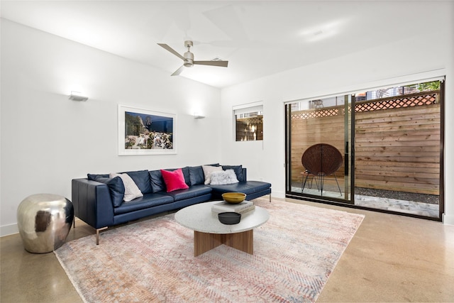 509 W Drew St, Houston, TX 77006 - living room featuring ceiling fan and baseboards