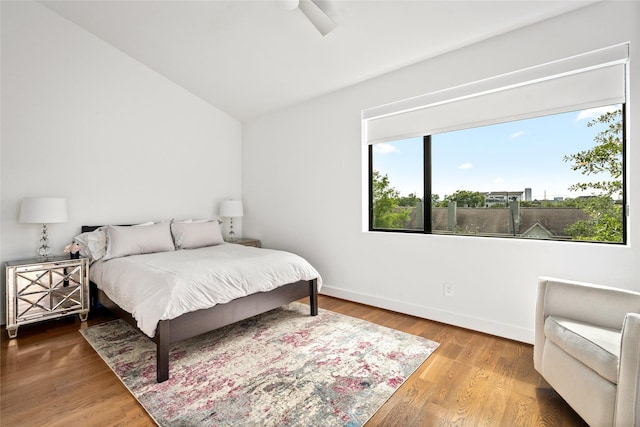 509 W Drew St, Houston, TX 77006 - bedroom featuring vaulted ceiling, baseboards, and wood finished floors