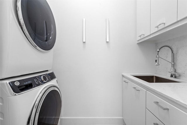 509 W Drew St, Houston, TX 77006 - laundry area with cabinet space and stacked washer and clothes dryer