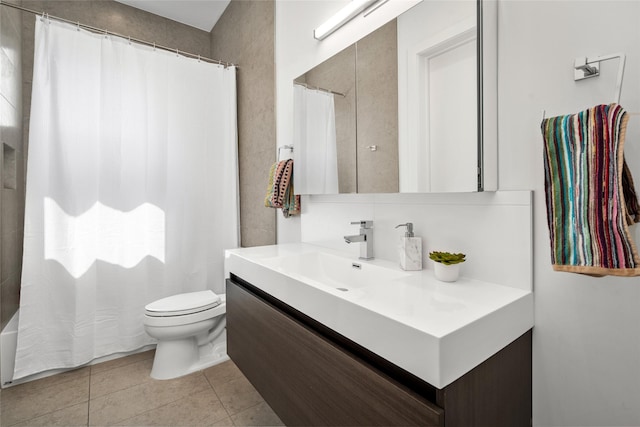 509 W Drew St, Houston, TX 77006 - bathroom featuring vanity, toilet, tile patterned floors, and shower / bath combo with shower curtain