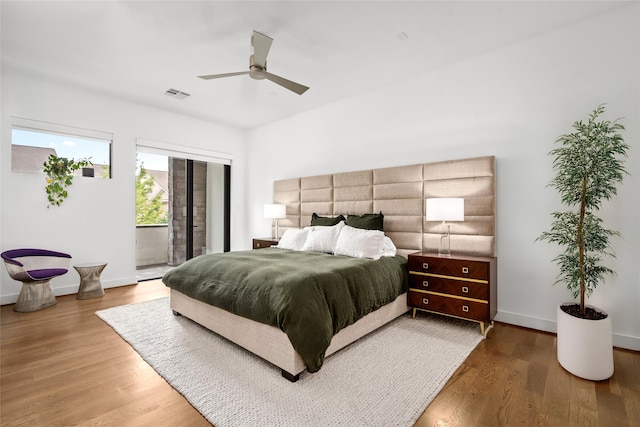 509 W Drew St, Houston, TX 77006 - bedroom featuring wood finished floors, ceiling fan, and baseboards