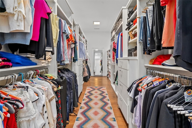 509 W Drew St, Houston, TX 77006 - walk in closet with light wood finished floors