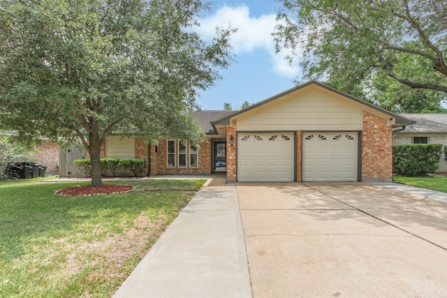 22519 Elkana Deane Ln, Katy, TX 77449 - ranch-style home with an attached garage, brick siding, concrete driveway, and a front yard