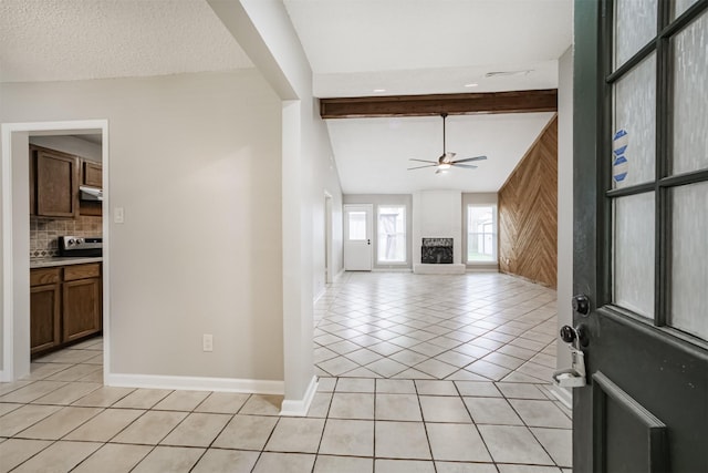 22519 Elkana Deane Ln, Katy, TX 77449 - entryway featuring light tile patterned floors, ceiling fan, baseboards, and beam ceiling
