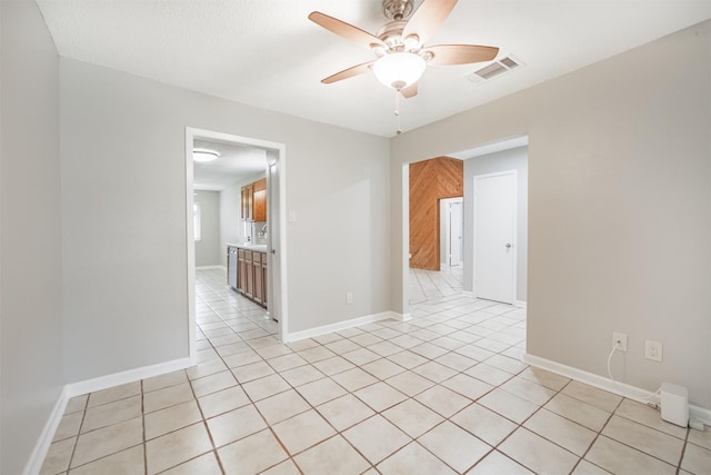 22519 Elkana Deane Ln, Katy, TX 77449 - empty room featuring a ceiling fan, light tile patterned floors, and baseboards