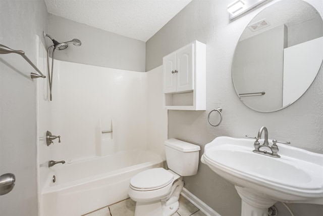 22519 Elkana Deane Ln, Katy, TX 77449 - bathroom featuring a sink, tile patterned flooring, toilet, bathing tub / shower combination, and a textured ceiling