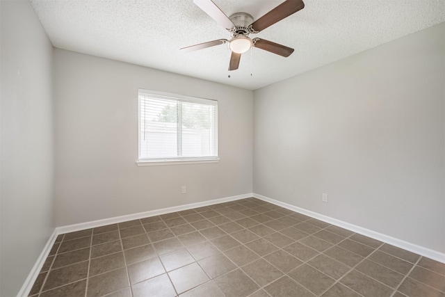 22519 Elkana Deane Ln, Katy, TX 77449 - tiled empty room with a textured ceiling, a ceiling fan, and baseboards