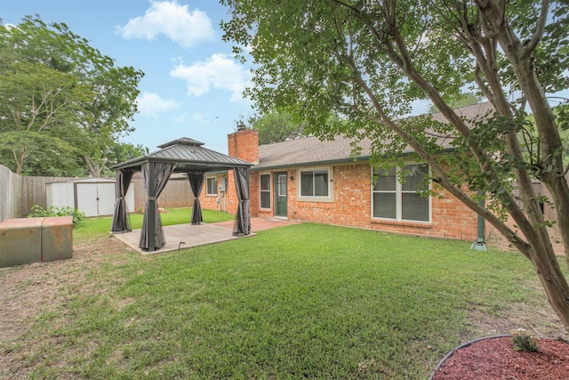 22519 Elkana Deane Ln, Katy, TX 77449 - back of house featuring a patio, a chimney, a gazebo, and brick siding