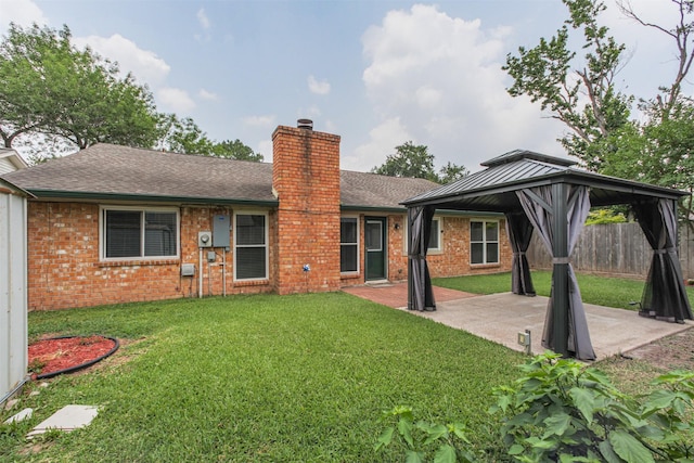 22519 Elkana Deane Ln, Katy, TX 77449 - back of property with a gazebo, a patio area, brick siding, a chimney, and roof with shingles