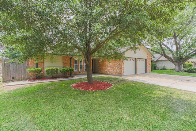 22519 Elkana Deane Ln, Katy, TX 77449 - view of property hidden behind natural elements with brick siding, a garage, and driveway