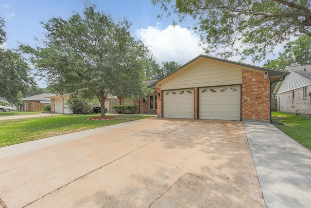 22519 Elkana Deane Ln, Katy, TX 77449 - ranch-style house featuring brick siding, driveway, a front yard, and an attached garage