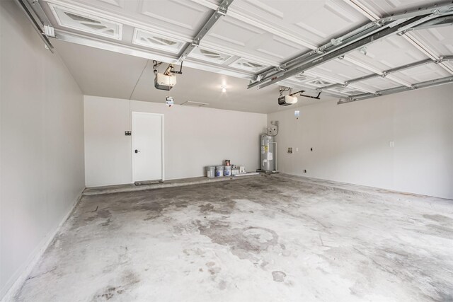22519 Elkana Deane Ln, Katy, TX 77449 - garage featuring water heater and a garage door opener