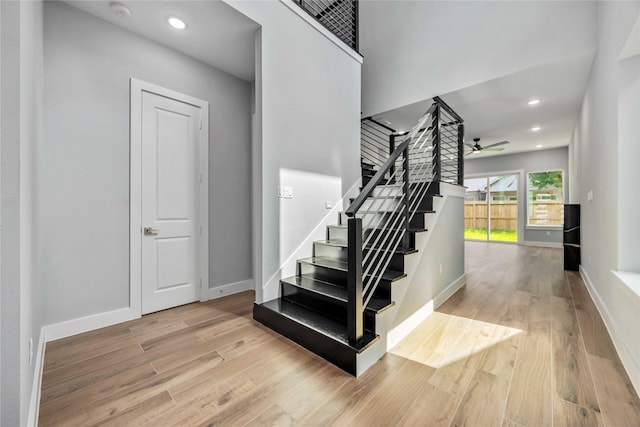 4923 Golden Forest St Unit A, Houston, TX 77091 - stairs featuring wood finished floors, a ceiling fan, baseboards, and recessed lighting
