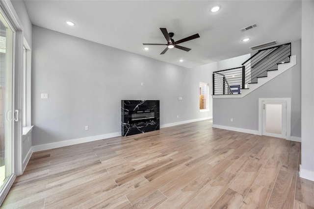4923 Golden Forest St Unit A, Houston, TX 77091 - unfurnished living room with ceiling fan, stairs, light wood-style floors, recessed lighting, and baseboards