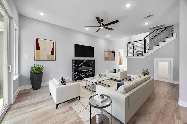 4923 Golden Forest St Unit A, Houston, TX 77091 - living area with stairway, ceiling fan, light wood finished floors, baseboards, and recessed lighting