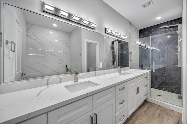 4923 Golden Forest St Unit A, Houston, TX 77091 - full bath with toilet, a shower stall, double vanity, and recessed lighting