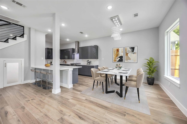 4923 Golden Forest St Unit A, Houston, TX 77091 - dining area featuring light wood-type flooring, recessed lighting, baseboards, and stairway