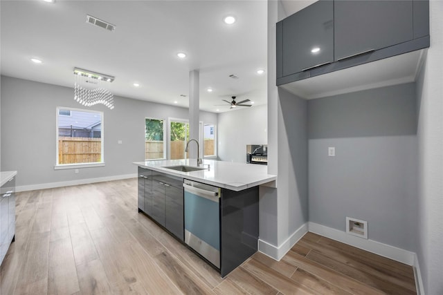 4923 Golden Forest St Unit A, Houston, TX 77091 - kitchen featuring dishwashing machine, modern cabinets, light wood-style floors, light countertops, and a sink