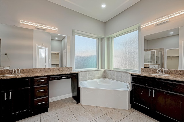 30806 Academy Trace Dr, Spring, TX 77386 - bathroom featuring a stall shower, two vanities, a bath, and tile patterned flooring