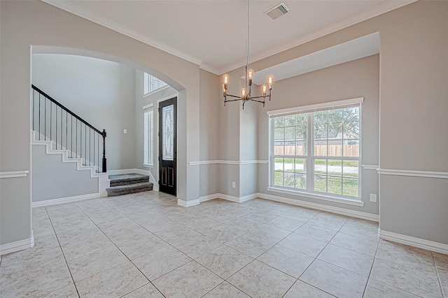 30806 Academy Trace Dr, Spring, TX 77386 - unfurnished dining area featuring ornamental molding, plenty of natural light, a chandelier, arched walkways, and stairs