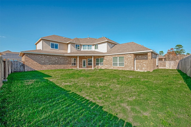 30806 Academy Trace Dr, Spring, TX 77386 - rear view of property with brick siding and a shingled roof