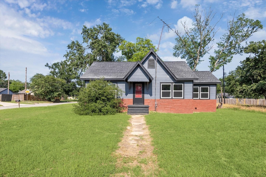 1275 Baker St, Hempstead, TX 77445 - bungalow-style home featuring a shingled roof and brick siding