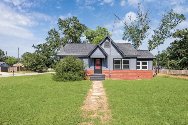 1275 Baker St, Hempstead, TX 77445 - bungalow-style home featuring a shingled roof and brick siding
