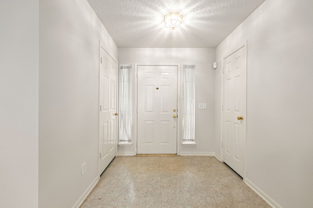 3031 W Cedar Sun Trl, Katy, TX 77449 - hallway with a textured ceiling and baseboards