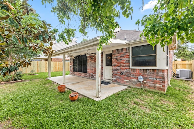 3031 W Cedar Sun Trl, Katy, TX 77449 - rear view of property with a ceiling fan, central air condition unit, brick siding, a patio, and a shingled roof