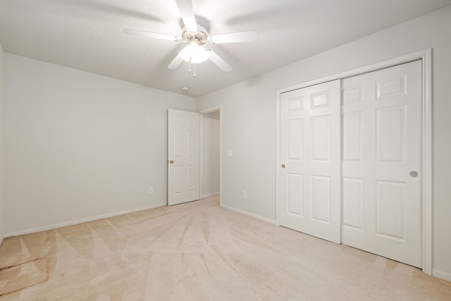 3031 W Cedar Sun Trl, Katy, TX 77449 - unfurnished bedroom with light carpet, baseboards, a closet, and a ceiling fan