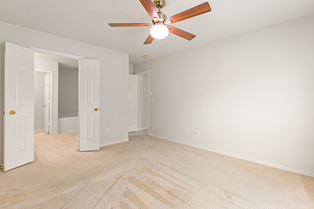 3031 W Cedar Sun Trl, Katy, TX 77449 - unfurnished bedroom with light carpet, baseboards, and ceiling fan