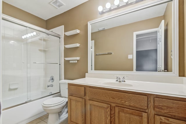 10502 Ginger Gln, Missouri City, TX 77459 - bathroom with vanity, toilet, combined bath / shower with glass door, and tile patterned floors