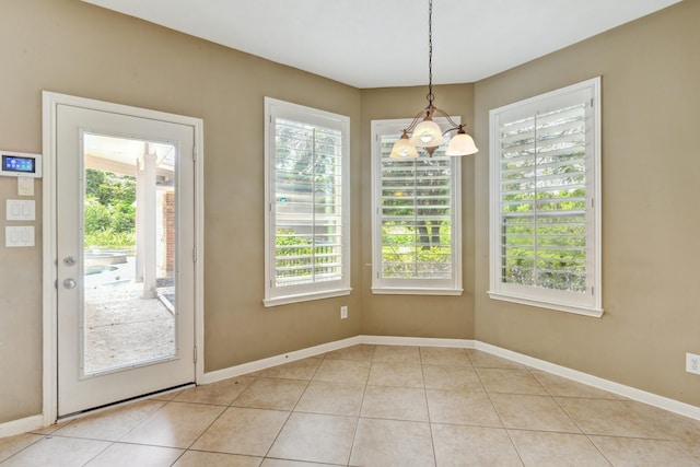 10502 Ginger Gln, Missouri City, TX 77459 - unfurnished dining area featuring plenty of natural light, light tile patterned flooring, and baseboards