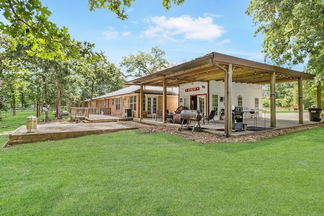 36 Jamaica Ln, Normangee, TX 77871 - view of green lawn featuring a patio area and french doors