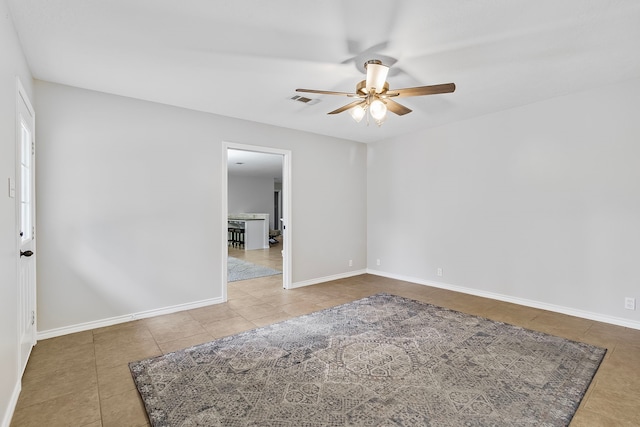 36 Jamaica Ln, Normangee, TX 77871 - unfurnished room featuring tile patterned floors, a ceiling fan, and baseboards