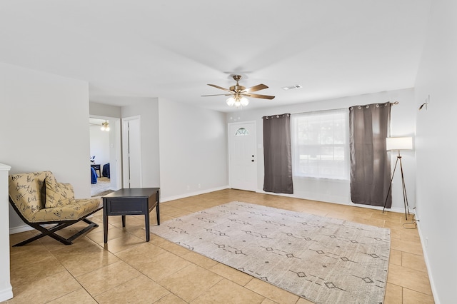 36 Jamaica Ln, Normangee, TX 77871 - sitting room featuring a ceiling fan, light tile patterned floors, and baseboards