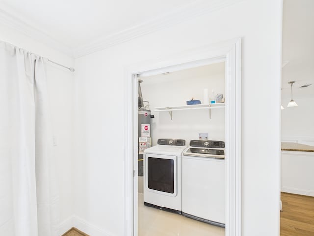 4927 Ward St, Houston, TX 77021 - laundry area featuring washer and dryer and ornamental molding