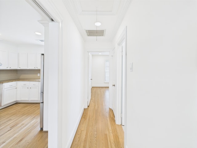 4927 Ward St, Houston, TX 77021 - hallway with light wood finished floors, ornamental molding, baseboards, and attic access
