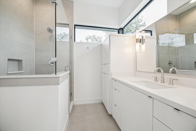 3851 Merrick St, Houston, TX 77025 - full bathroom featuring a stall shower, tile patterned floors, vanity, and baseboards