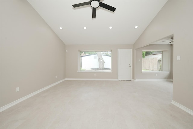 9607 Rumbling Wood Ln, Houston, TX 77086 - unfurnished living room with a ceiling fan, recessed lighting, vaulted ceiling, and baseboards